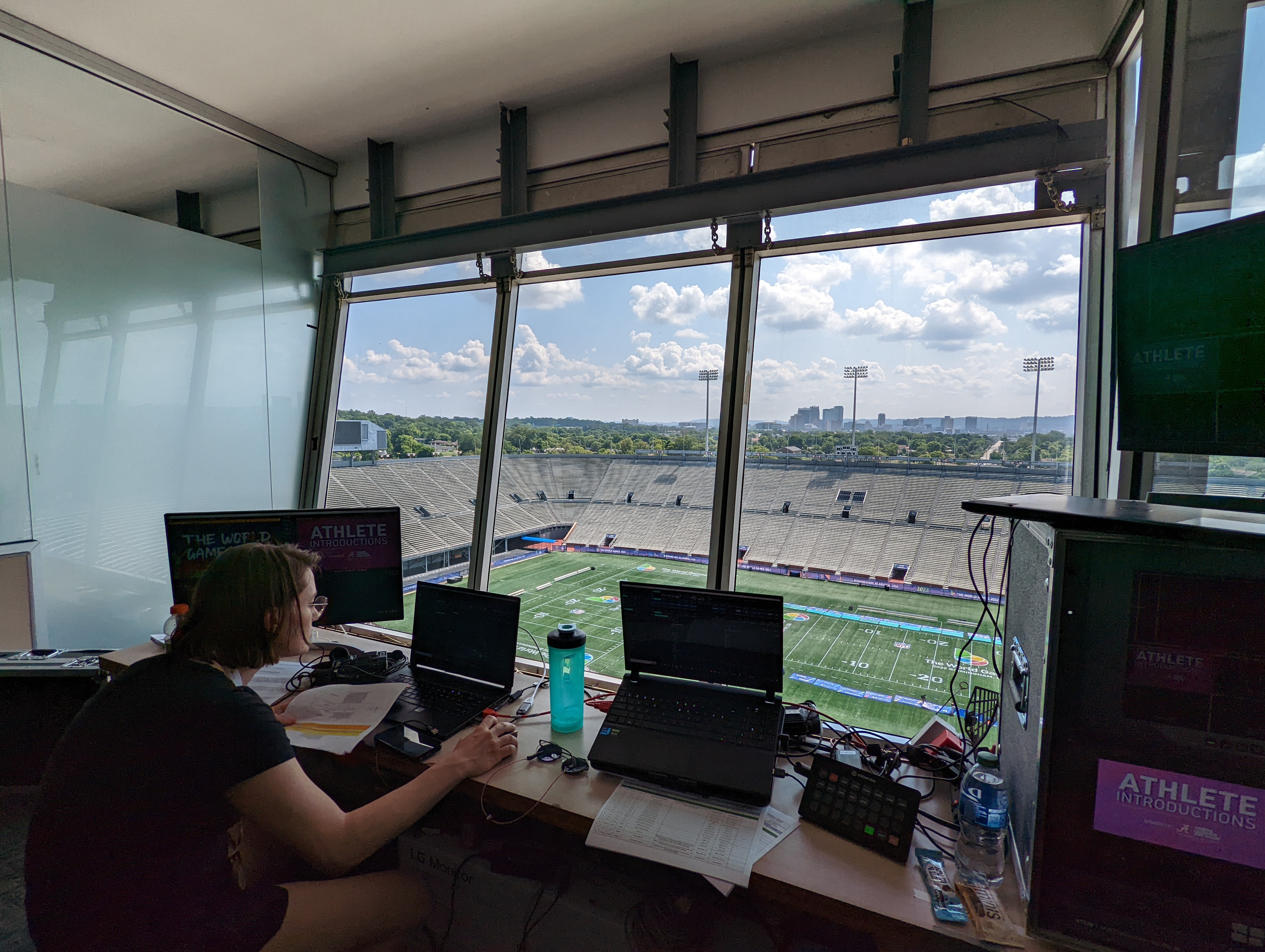 Operator at a switcher desk overlooking the field