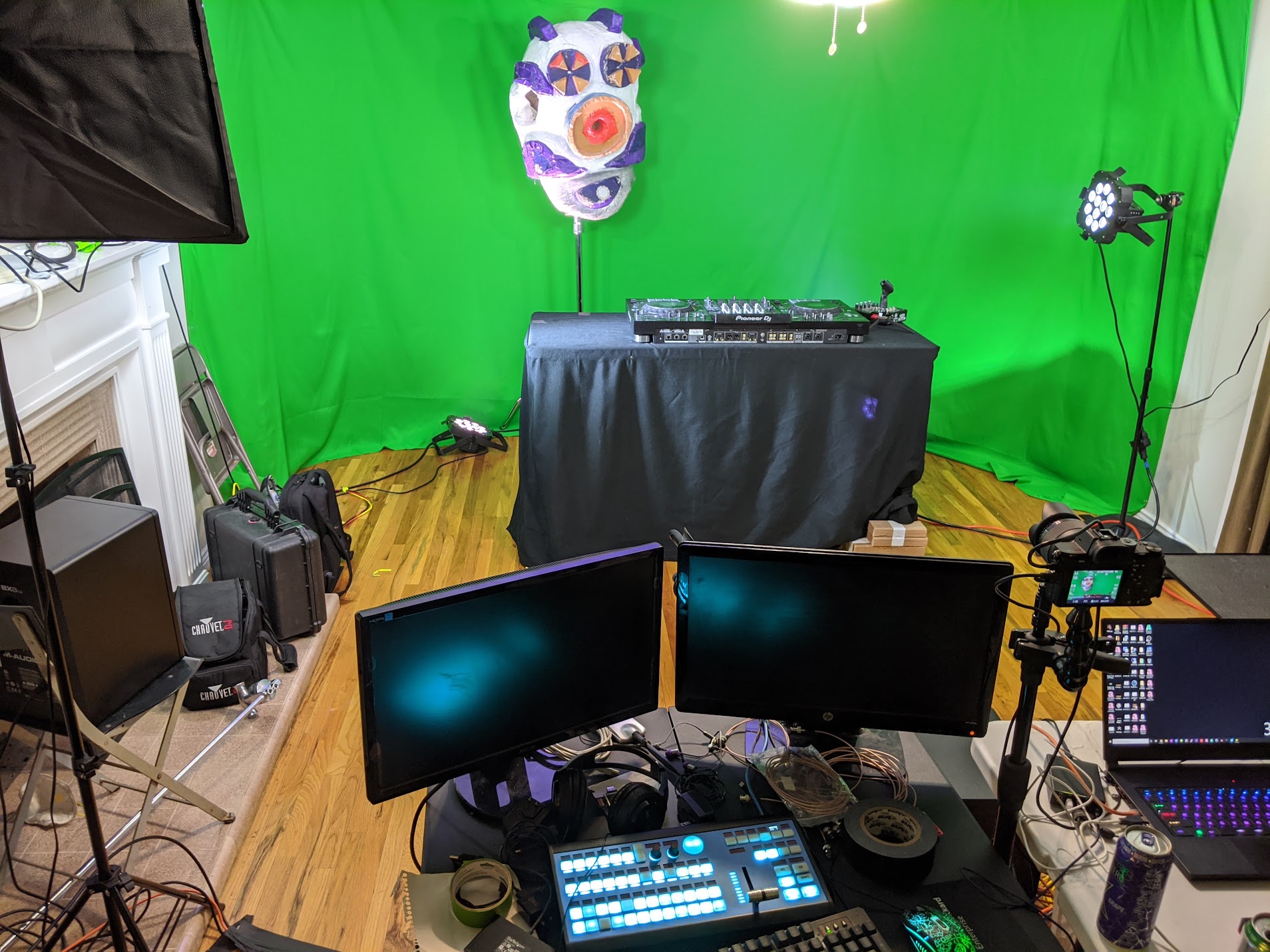 Home production studio with DJ rig, switcher, green screen