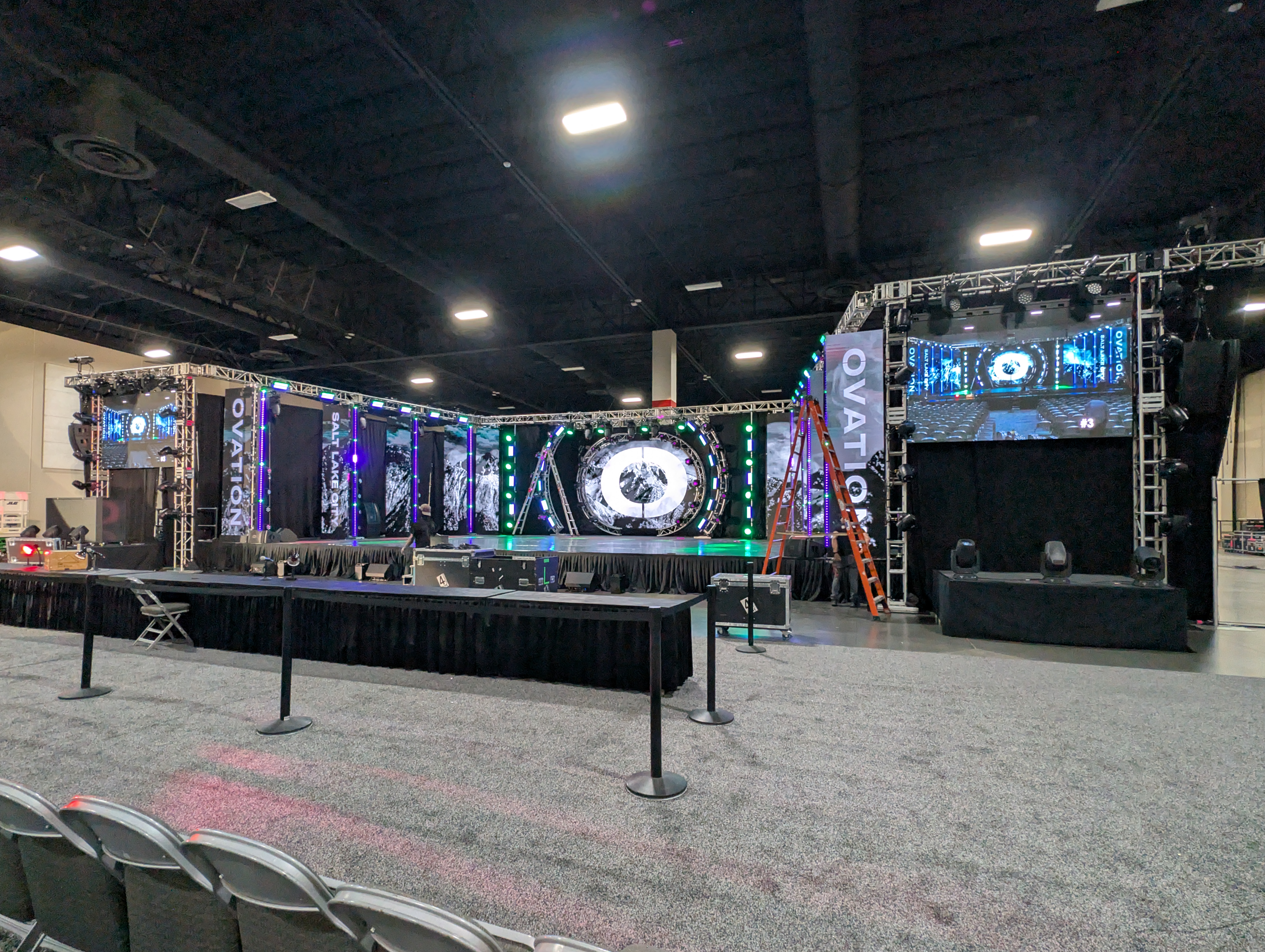 Convention center stage with LED arch and video walls