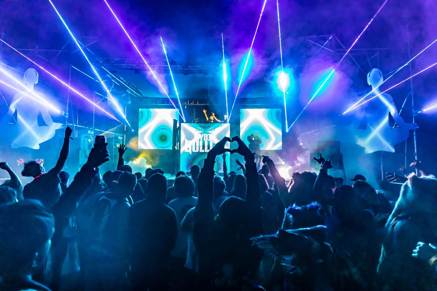 Crowd under blue lasers at a DopeSouls underground show